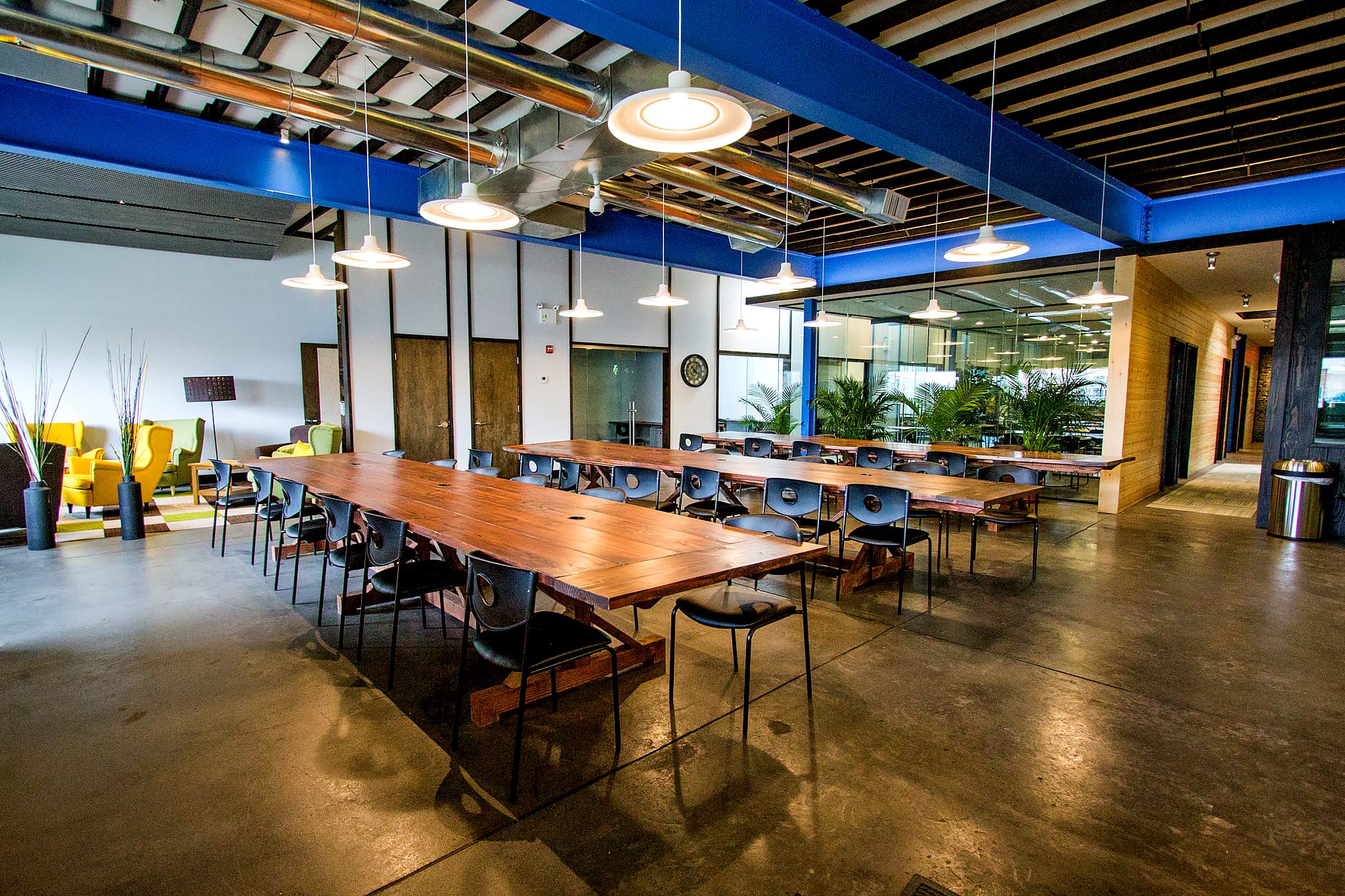 Bridgeworks main space with communal tables and lounge seating
